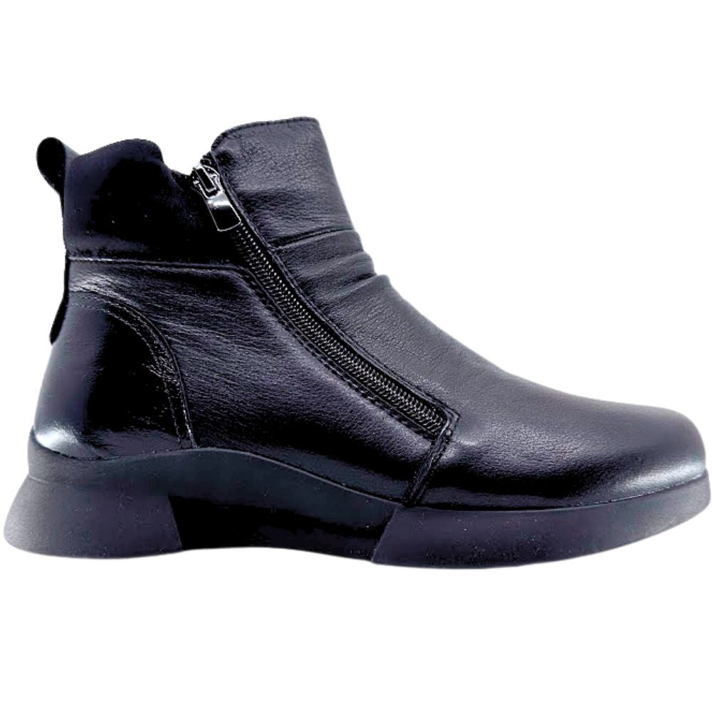 Black ankle boot with a zipper on a white background