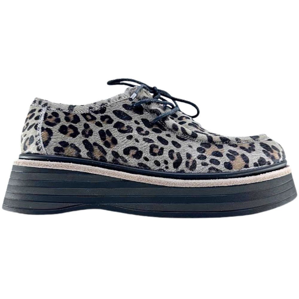 Leopard print shoe with a thick sole on a white background