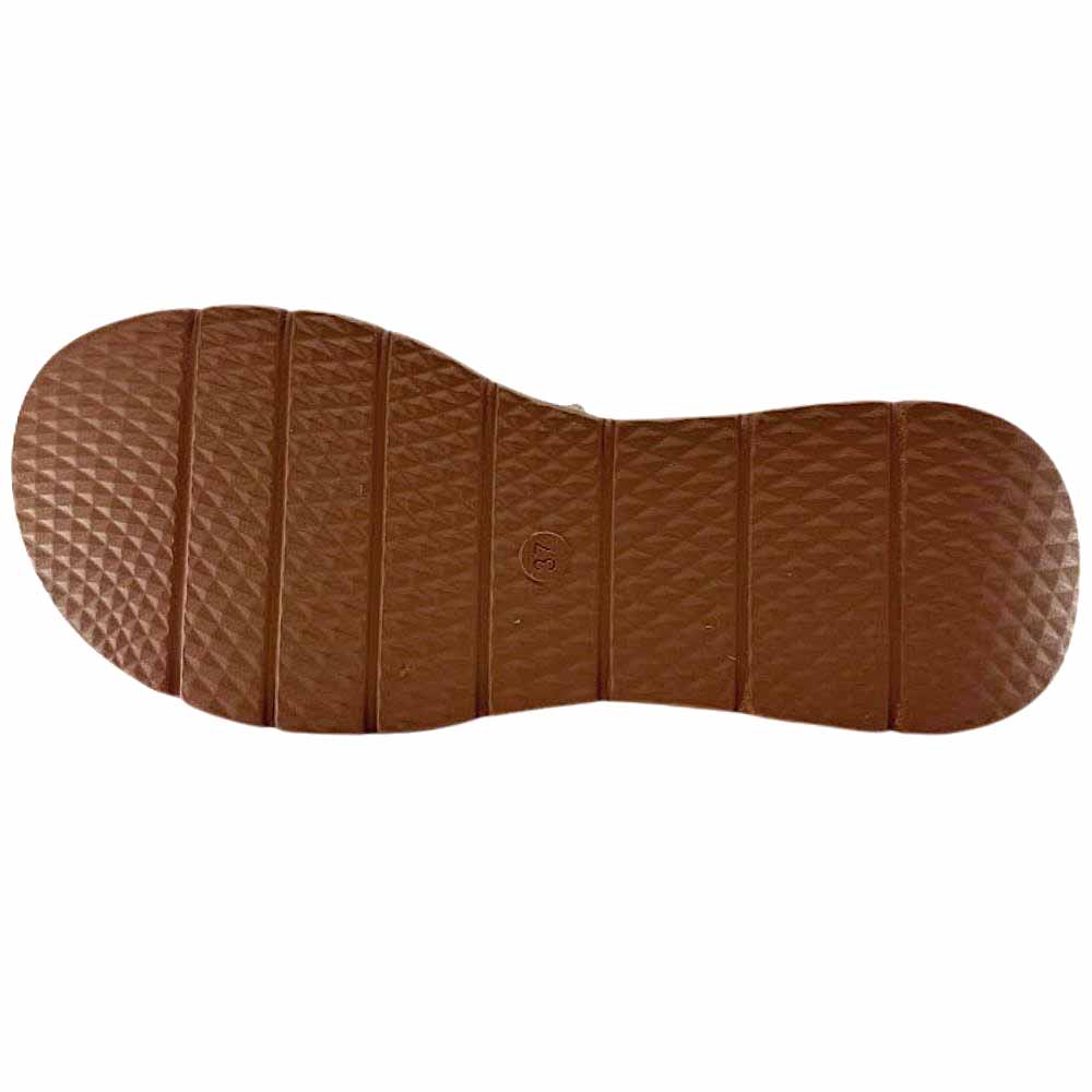 The brown rubber outsole of an Alfie & Evie sandal with a tread pattern, against a white background.