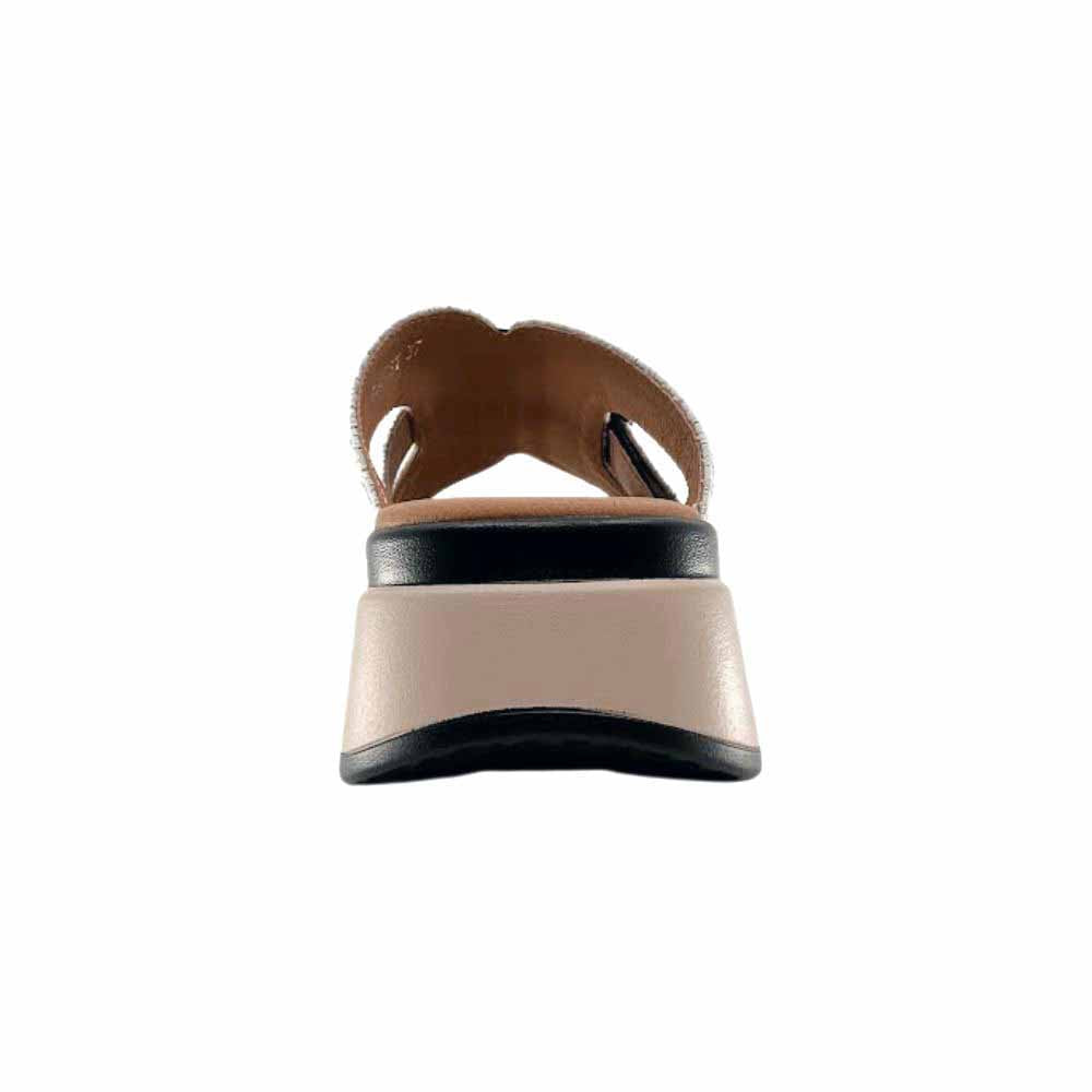 The back of a black leather slide with a brown and black platform sole, set against a white background.