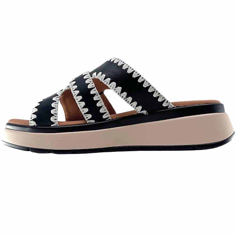 Black leather slide with white stitched edging, a bronze buckle and a brown and black platform sole, set against a white background.