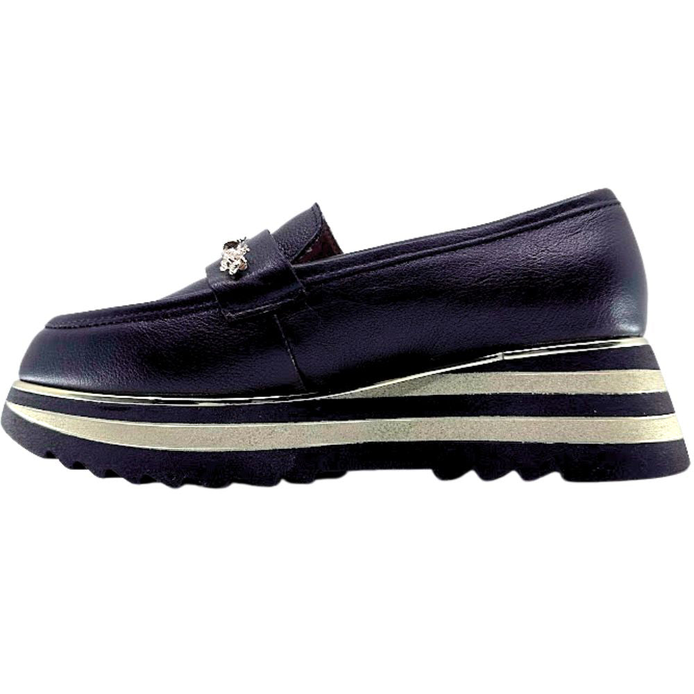 Black loafer with gold bees and a striped gold and black sole on a white background