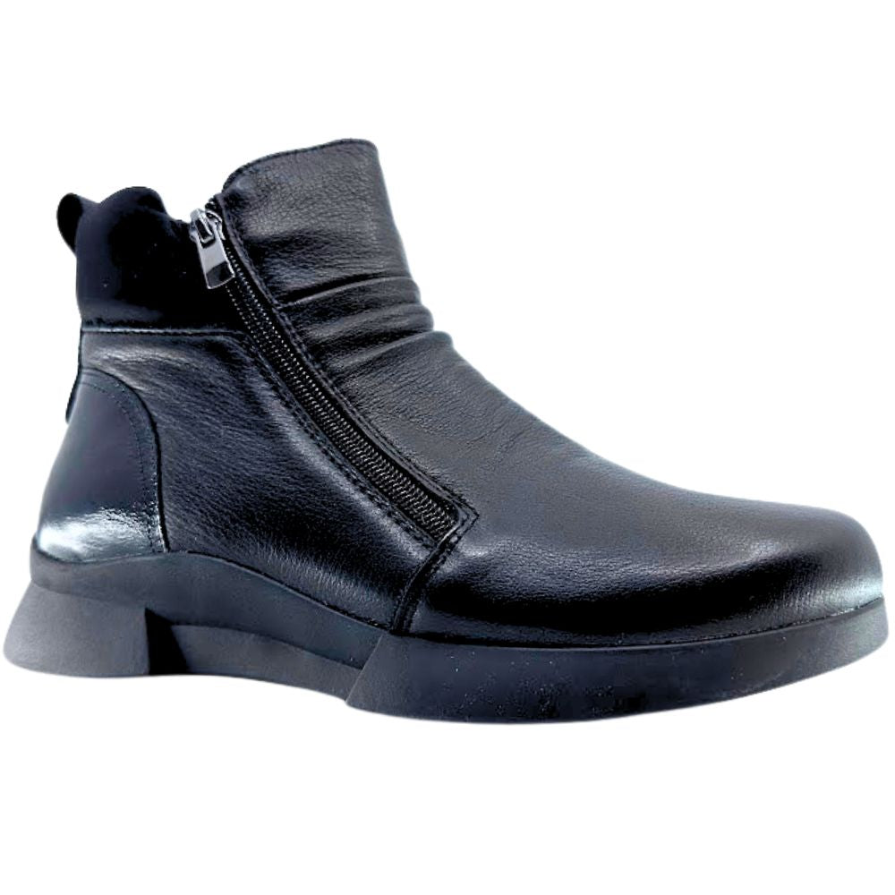 Black ankle boot with a zipper on a white background