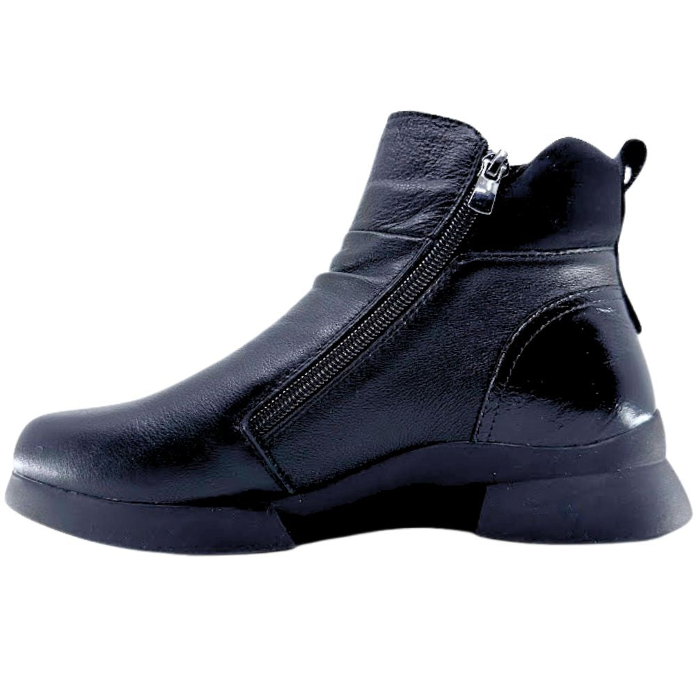 Black ankle boot with a zipper on a white background