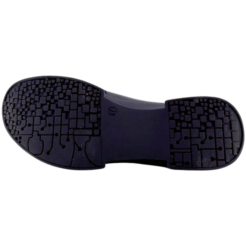 Black rubber sole of a shoe on a white background