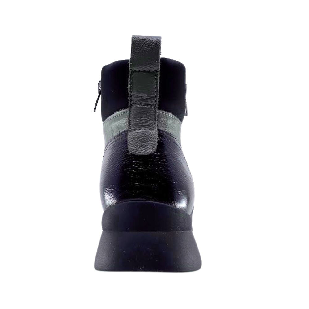 Black boot with a rear pull strap on a white background
