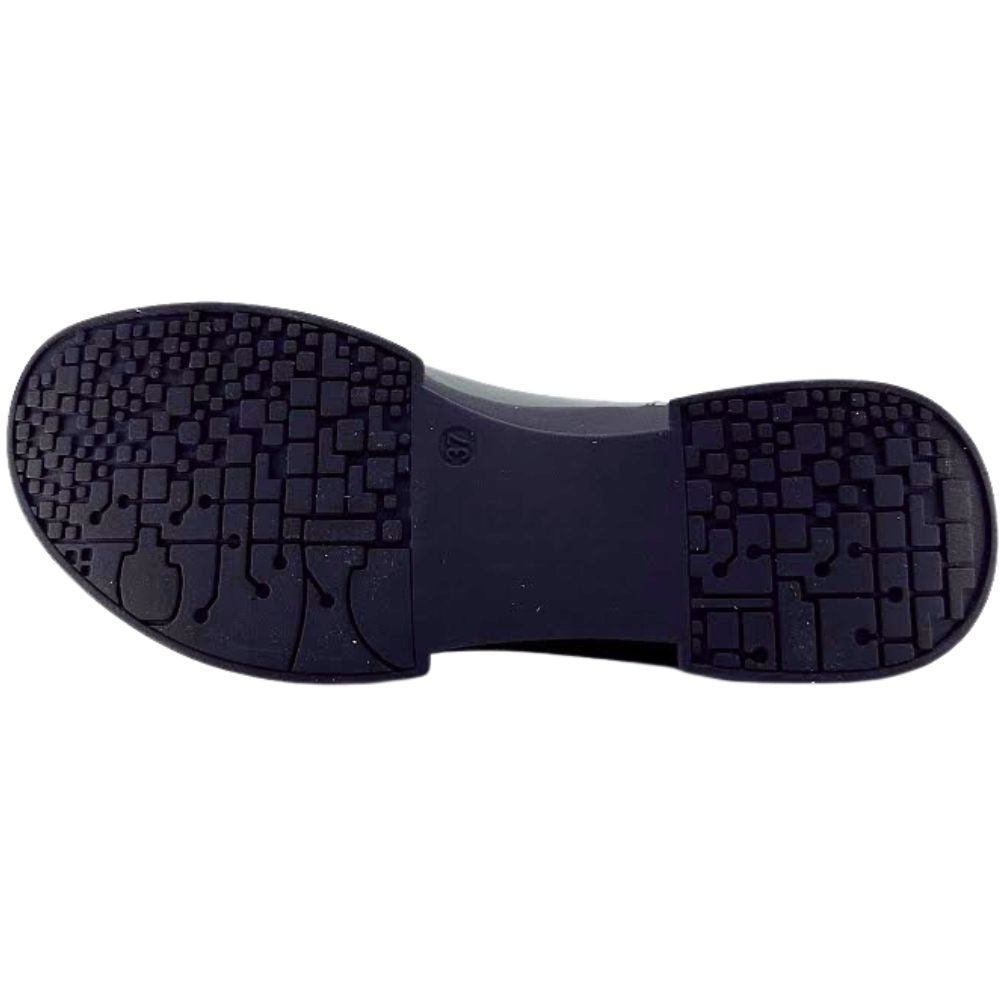 Black shoe sole with tread pattern on a white background