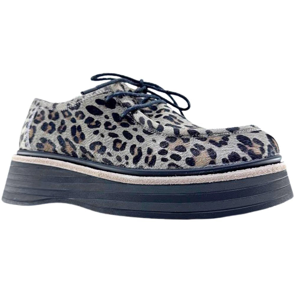 Leopard print shoe with a thick sole on a white background
