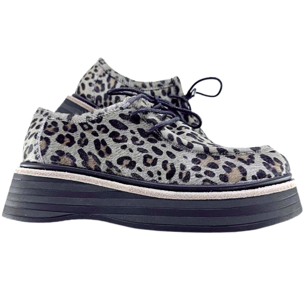 Leopard print sneakers with a thick sole on a white background