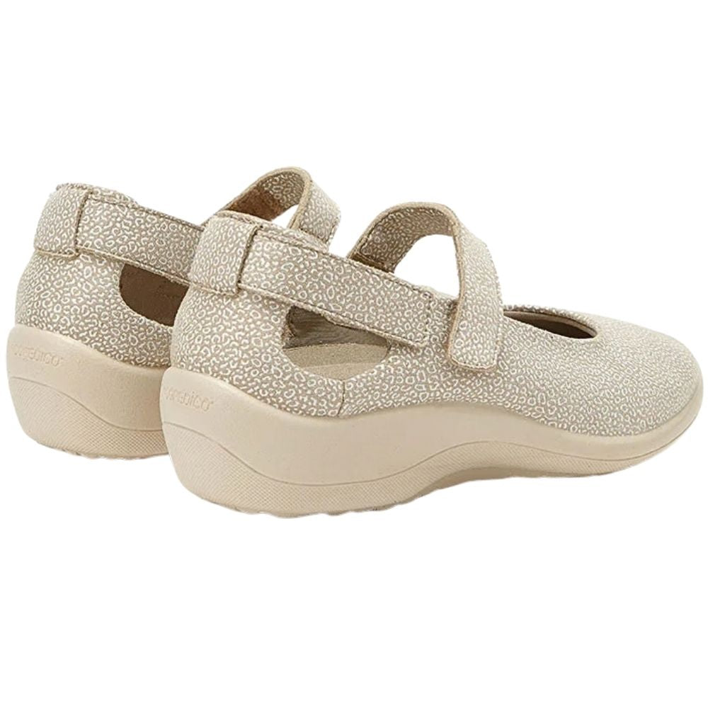 A pair of women's Mary Jane style shoes in a light beige color with a subtle speckled texture, featuring double straps and a flexible sole, shown against a plain white background.