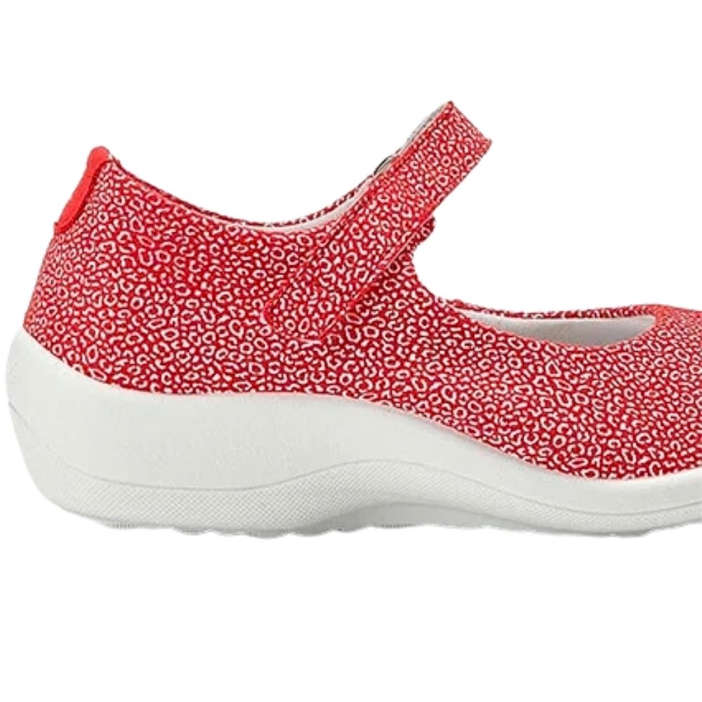 A red and white patterned Mary Jane shoe with a hook-and-loop strap and a thick white sole, shown in a side profile view against a white background.