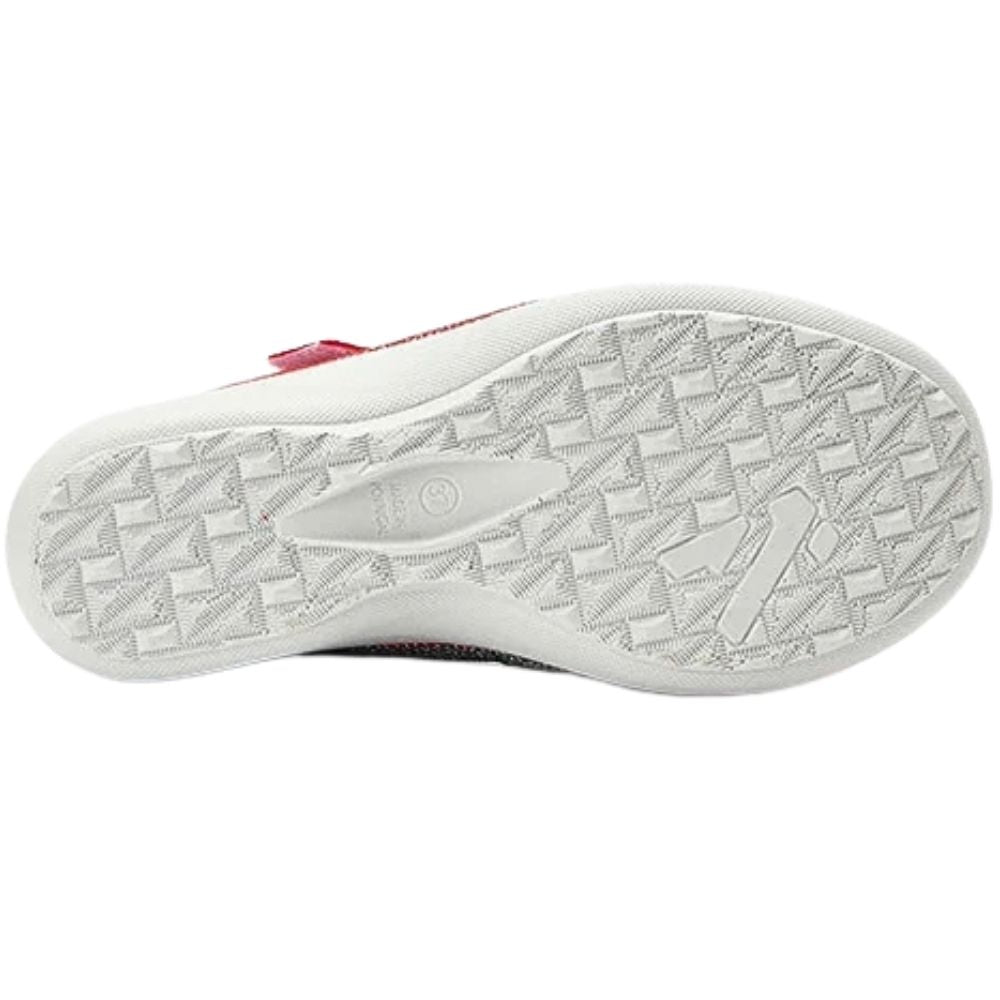 A close-up view of a shoe's white textured outsole, showing a geometric tread pattern with the text 'Made In Portugal'.