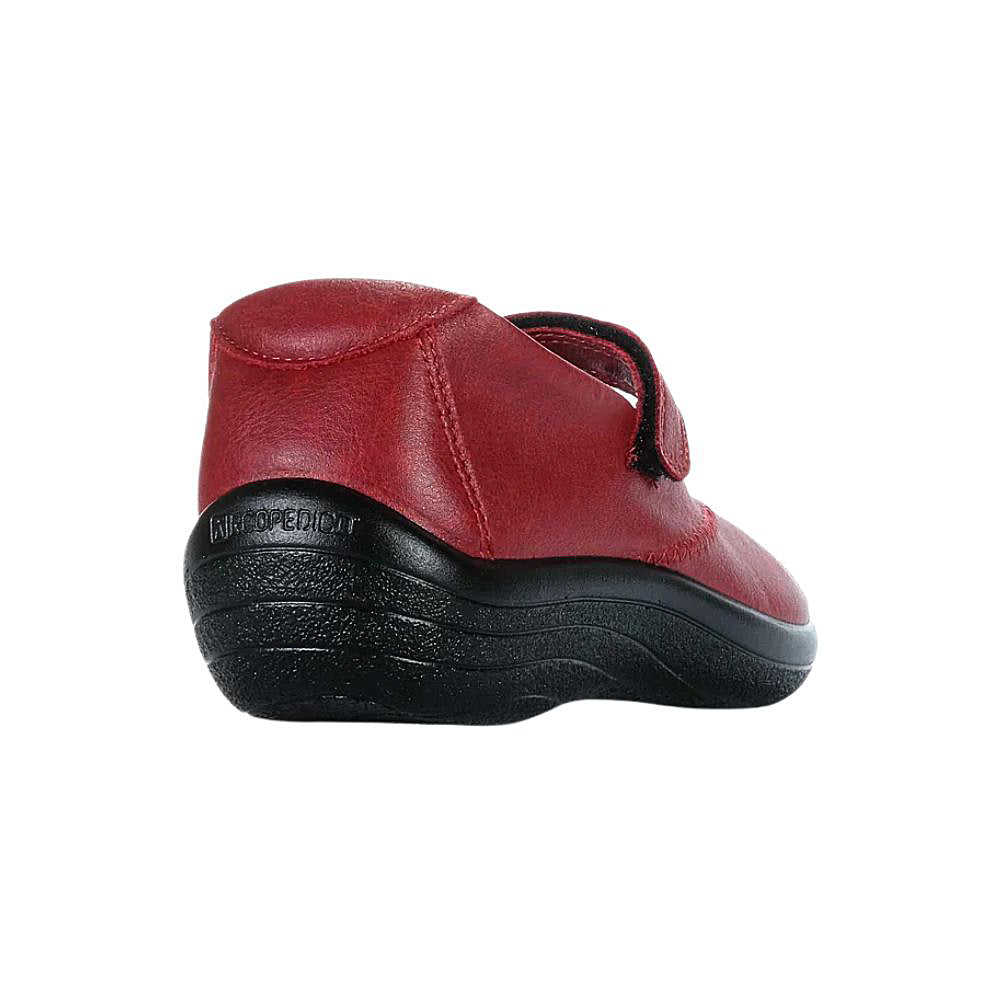 Red Mary-Jane shoe with a black sole on a white background