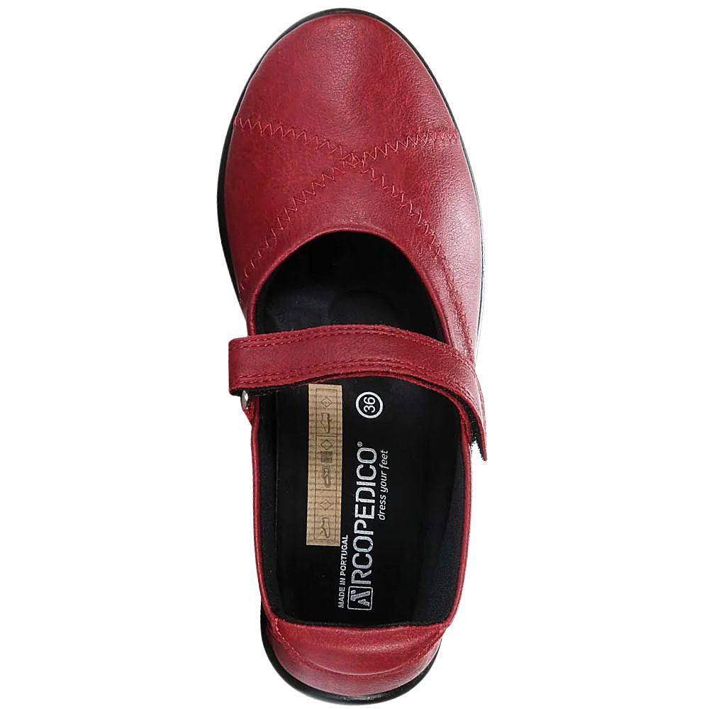 Red Mary-Jane shoe with a strap on a white background