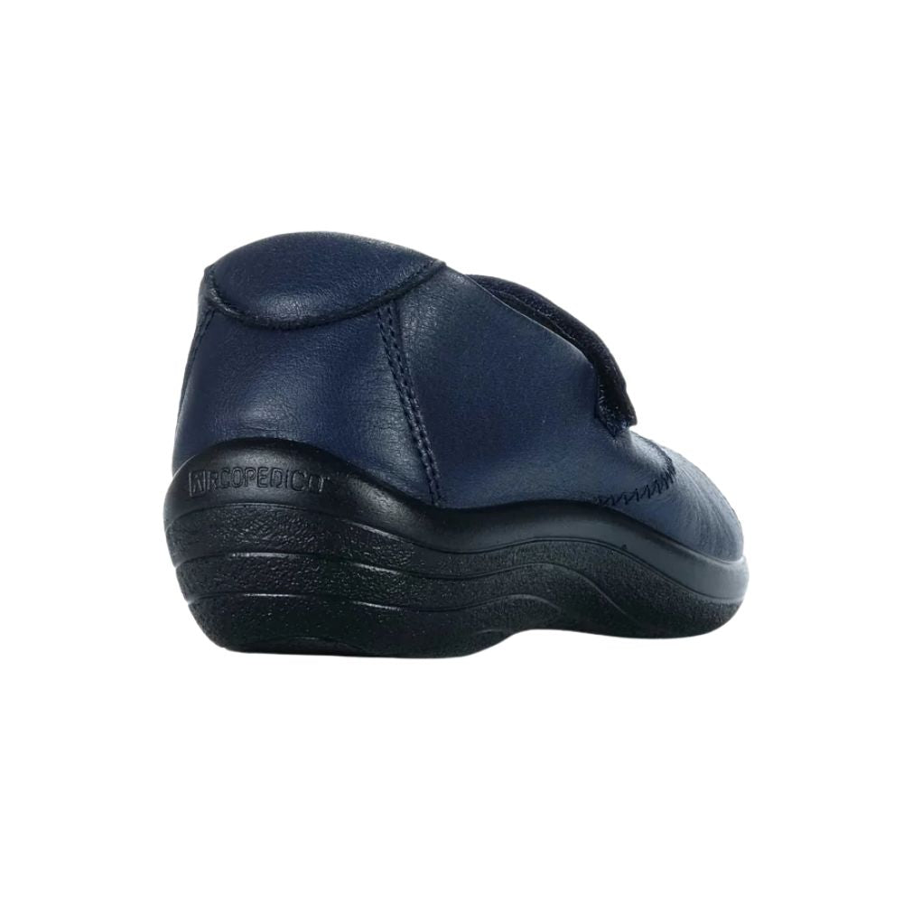 Back of a navy blue shoe with black sole embossed with 'Acropedico' on a white background