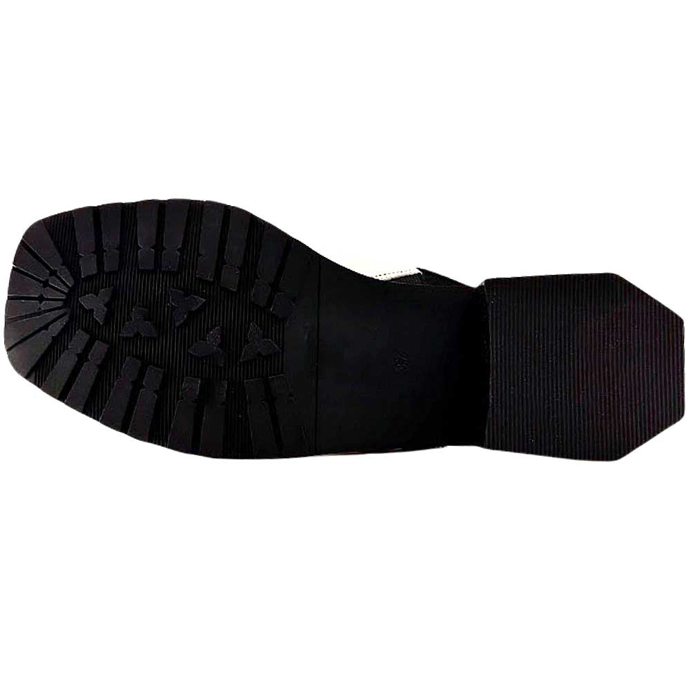 The black rubber outsole of a slingback sandal with good tread, against a white background
