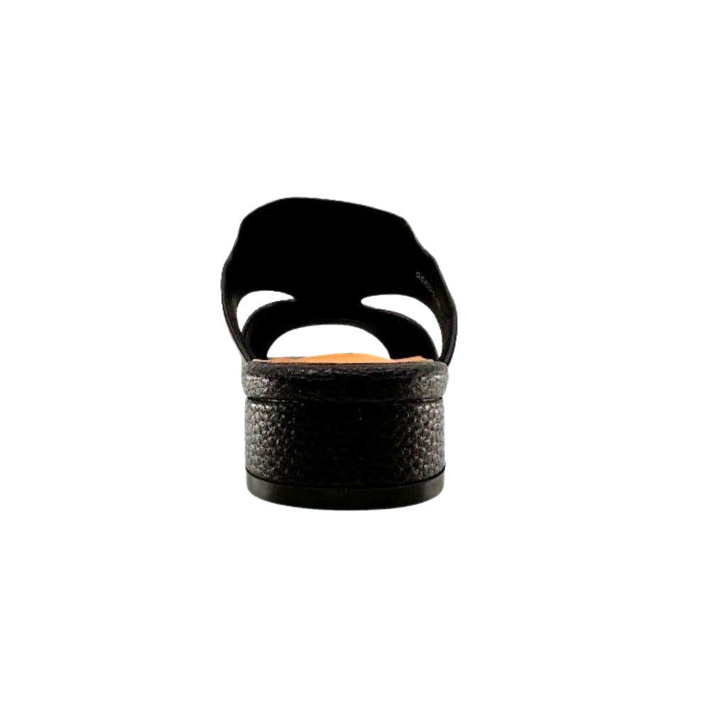 A single black sandal shown from the back, featuring a leather wrapped low block heel and a wide cutout strap, set against a plain white background.