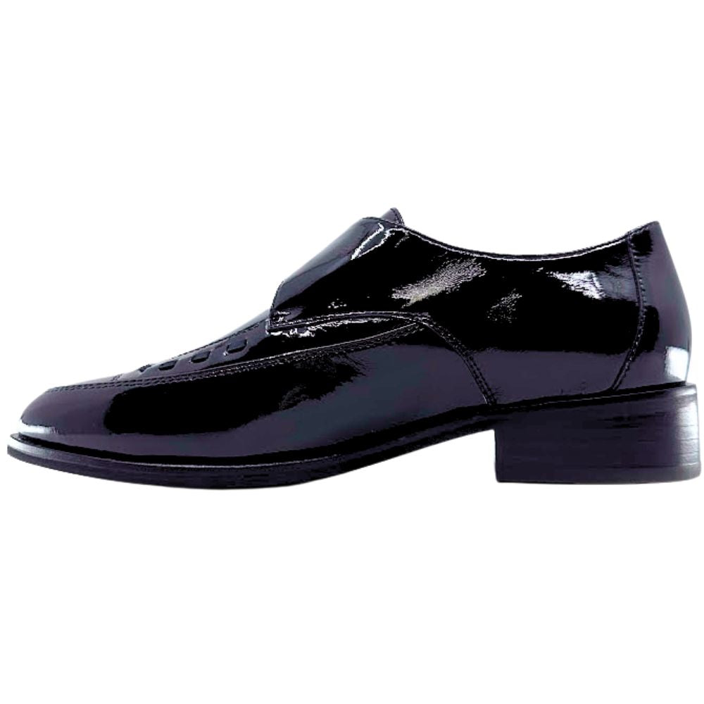 Black patent leather dress shoe on a white background