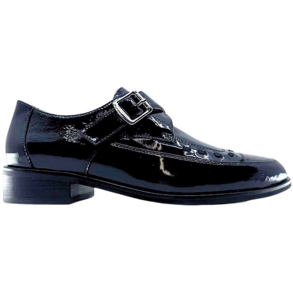 Black patent leather dress shoe with a buckle on a white background