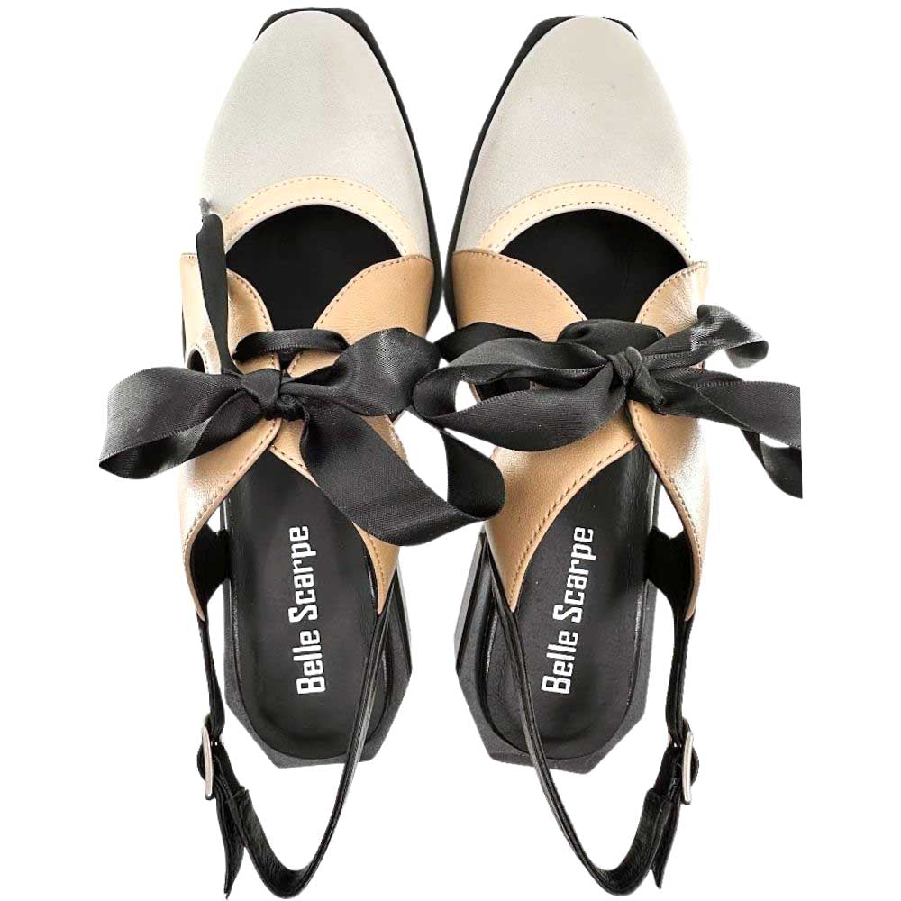 A pair of Belle Scarpe pointed-toe slingback heel sandals in beige and black leather, featuring large black satin bows across the instep and black slingback straps.