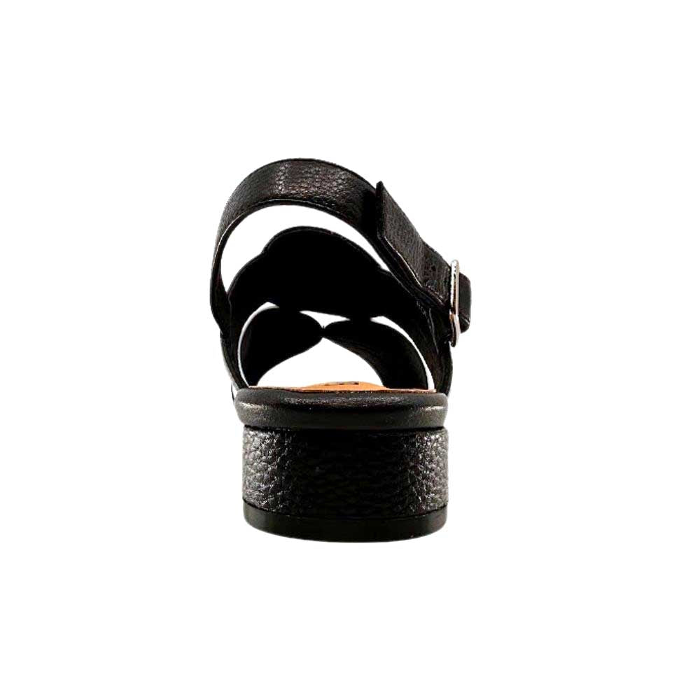 The back view of a black and white leather slingback sandal with a low block heel, on a white background.