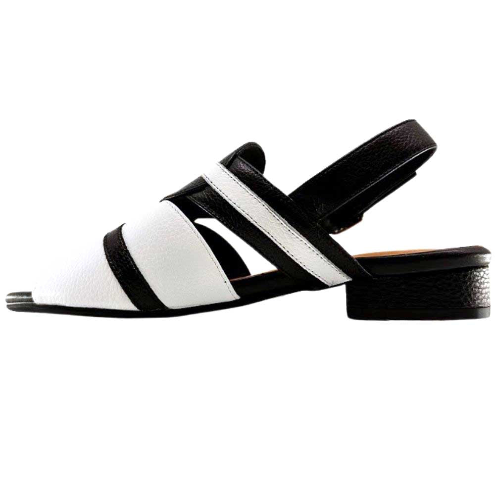 A black and white leather slingback sandal with a low block heel and adjustable buckle strap, shown in a side profile on a white background.