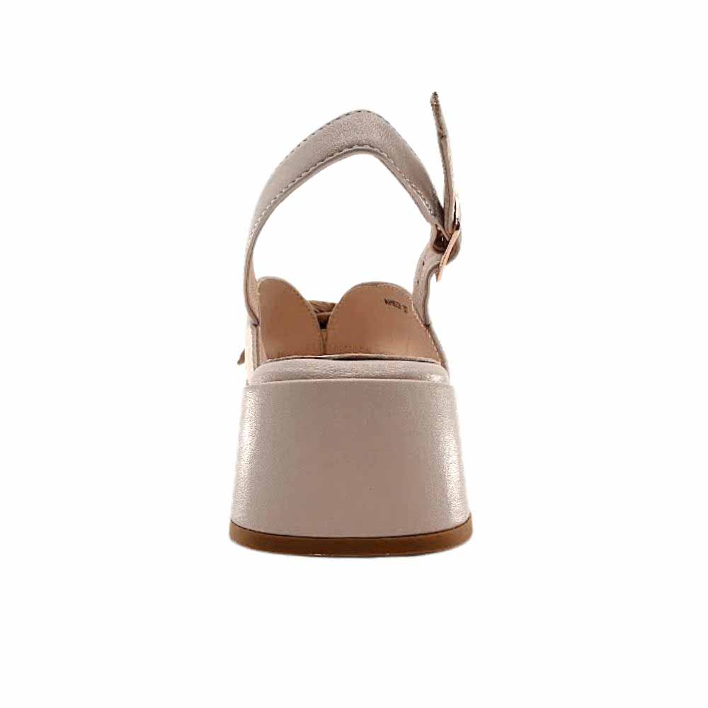 The back view of a single nude leather sandal with a low block heel, against a white background.