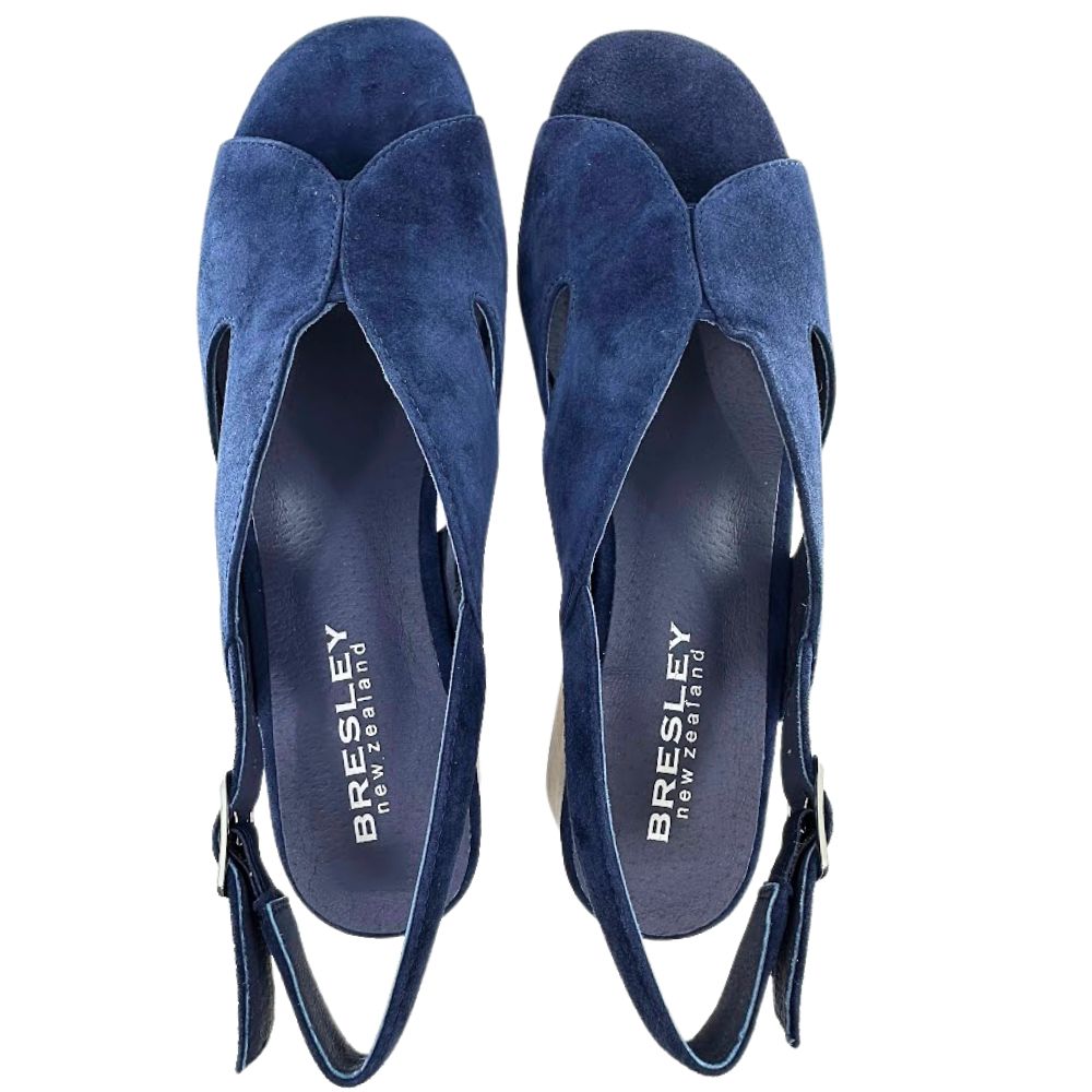 A pair of blue suede heeled sandals, with peep toe and a V throat, shown from a top-down view on a white background. The brand name 'BRESLEY' is visible on the insoles.