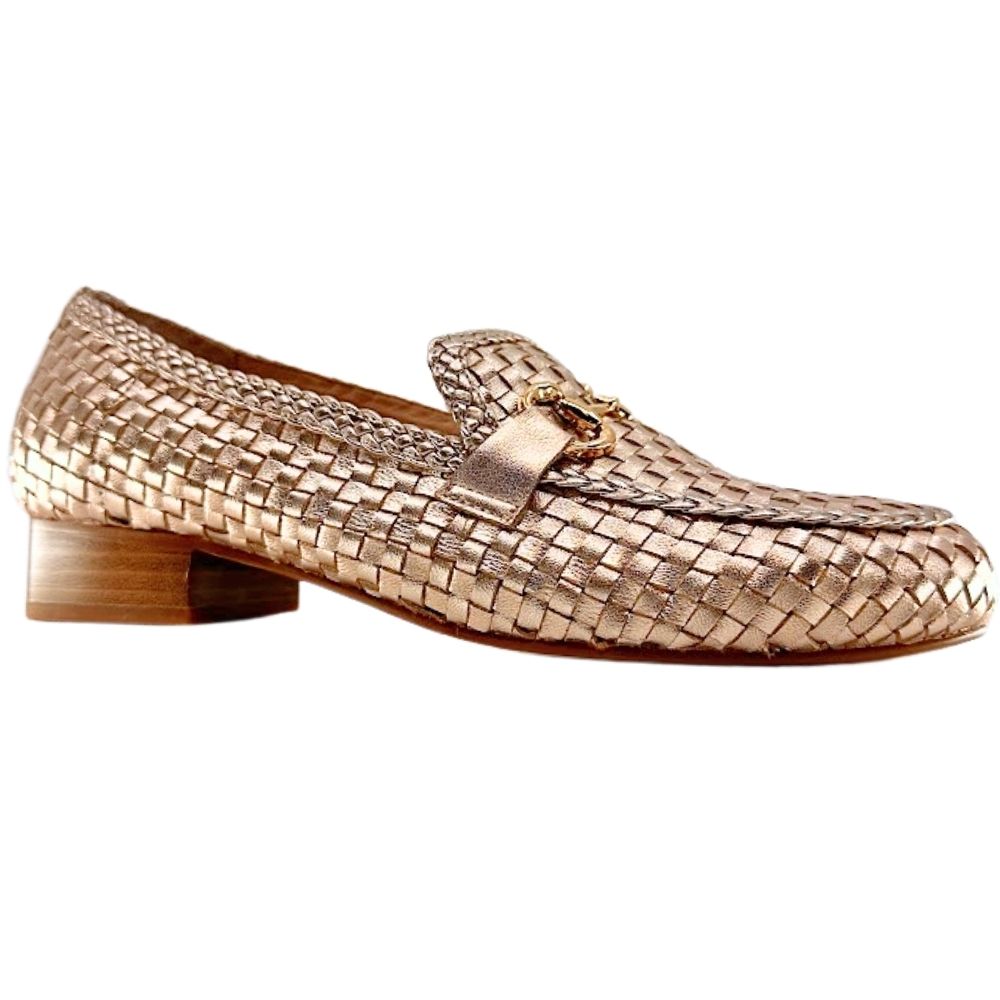 A single woven leather loafer in a metallic rose gold finish, featuring a low block heel and a decorative horsebit detail on the vamp, shown against a plain white background.