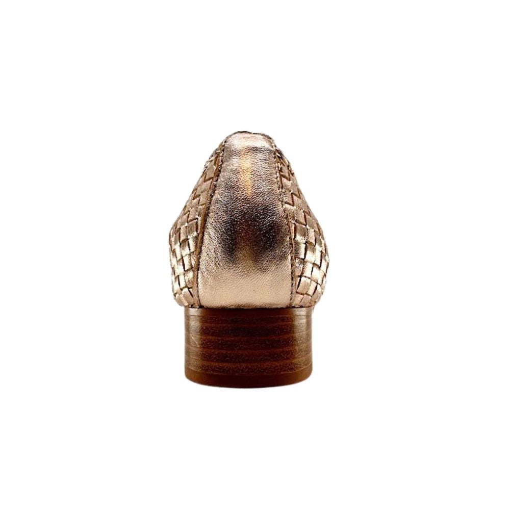 Back of a rose gold woven leather loafer with a small brown block heel on a white background