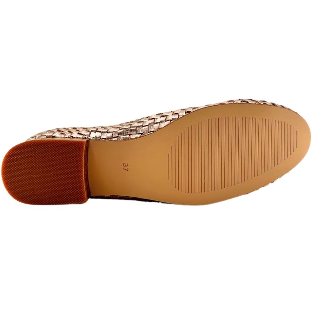 The tan outsole of a shoe sole with good tread pattern, against a white background.
