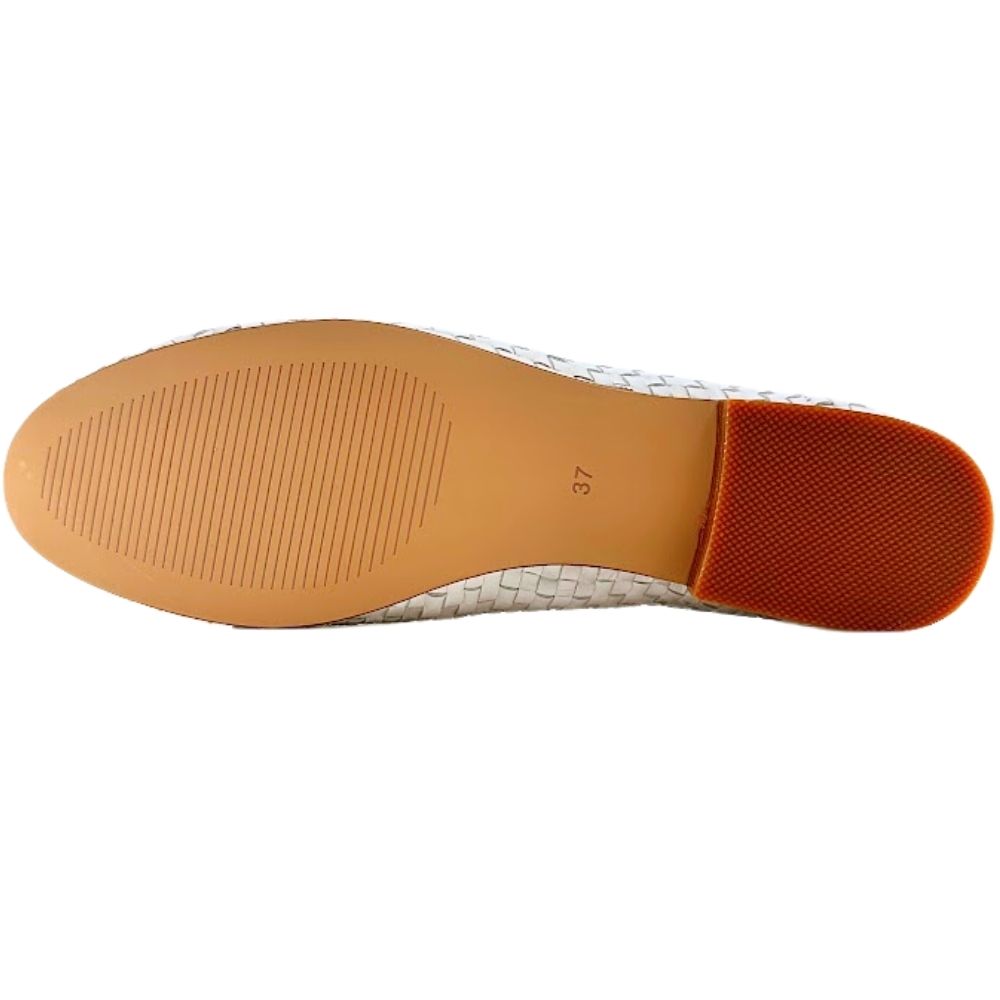 A top-down view of a shoe sole showing a tan rubber outsole with a textured brown heel block, on a white background.