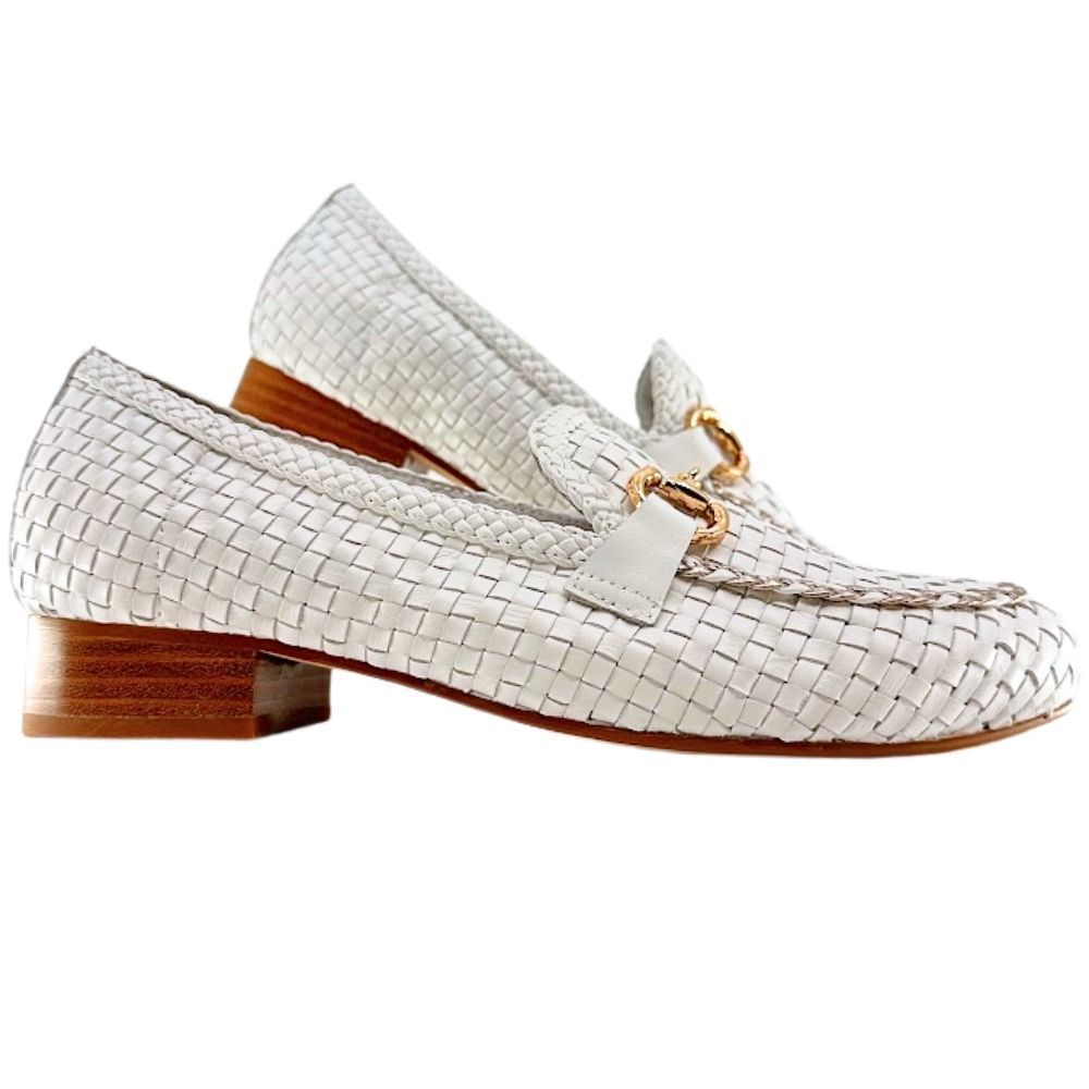 A pair of white woven leather loafers with a small gold-tone horsebit detail on the vamp and a low brown block heel, shown against a plain white background.