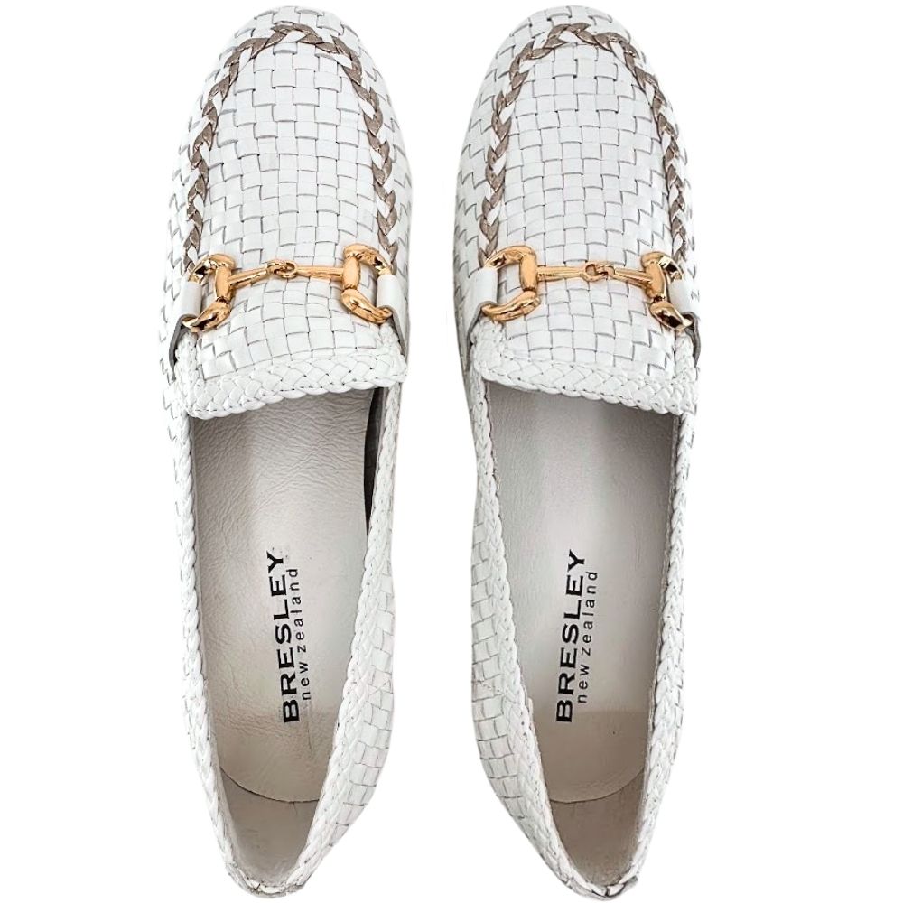 A pair of white woven leather loafers by Bresley, featuring a gold horsebit hardware detail across the vamp and a gold braided trim along the toe edge, shown against a plain white background.