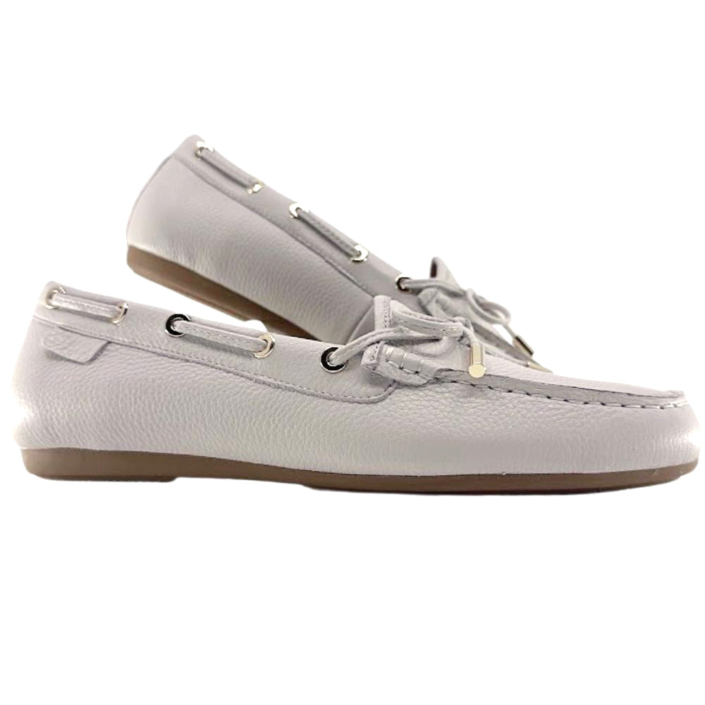 Pair of cream leather boat shoes on a white background