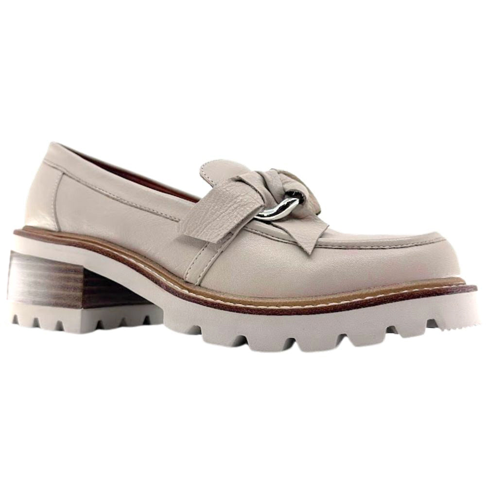 Cream loafer shoe with a chunky sole on a white background