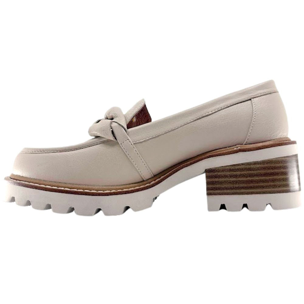 Cream loafer shoe with a chunky sole on a white background