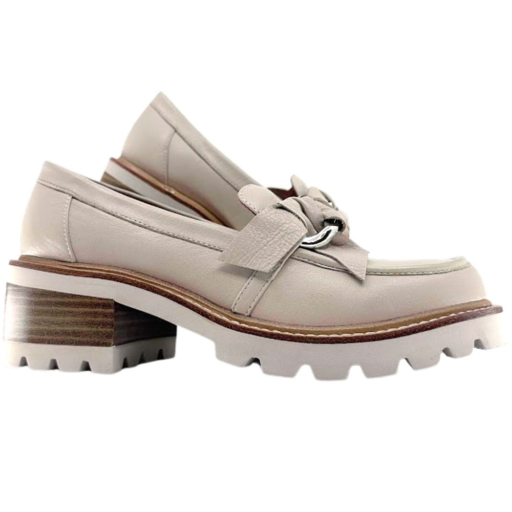 Cream loafers with a chunky sole on a white background