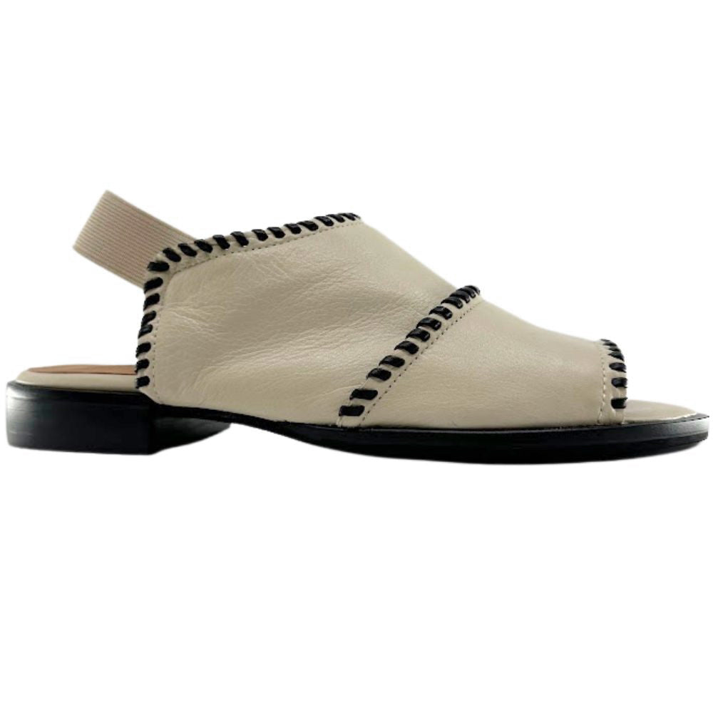A single cream leather slingback sandal with black contrast stitching and a black sole, shown in a side profile on a white background.