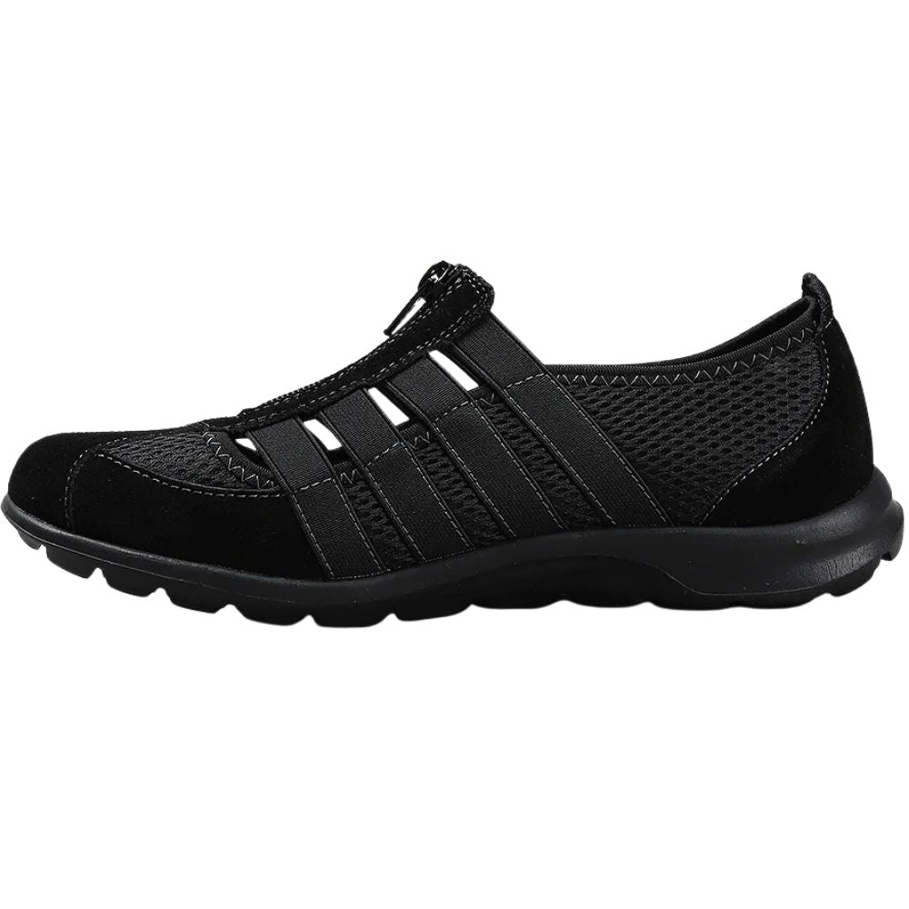 Black slip-on shoe on a white background