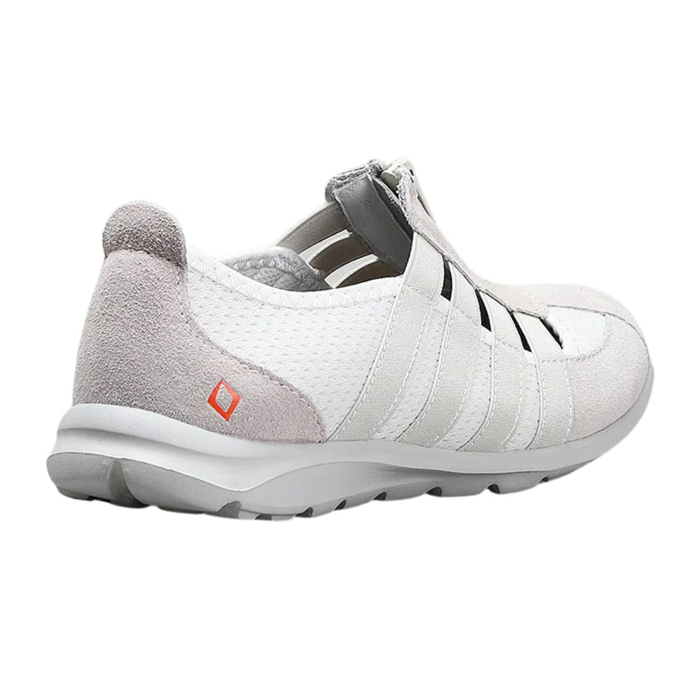 Cream casual shoe with taupe accents on a white background