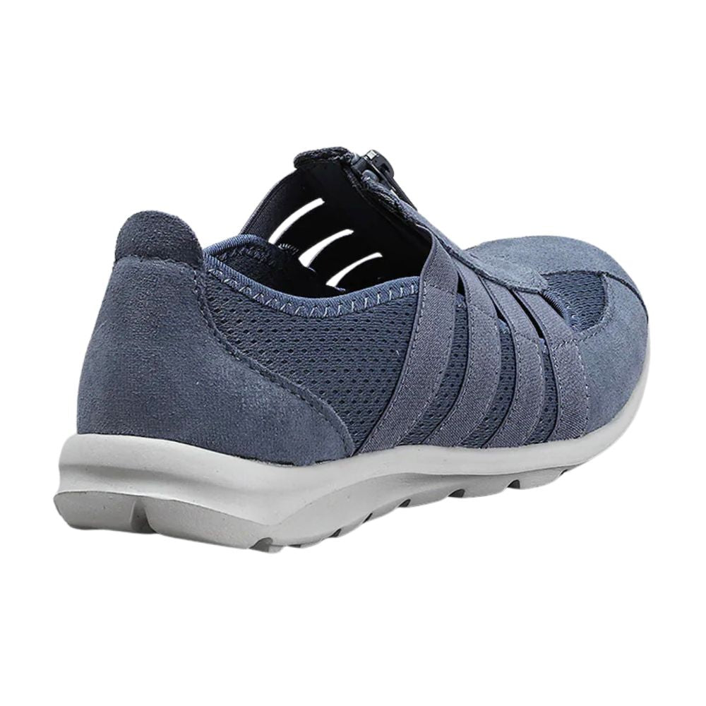 Blue slip-on shoe with grey sole on a white background