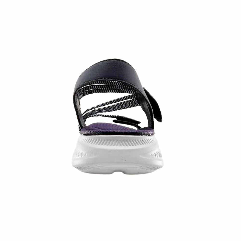 The back view of a single navy blue sandal with elasticated navy and white straps on a white sole, set against a white background.