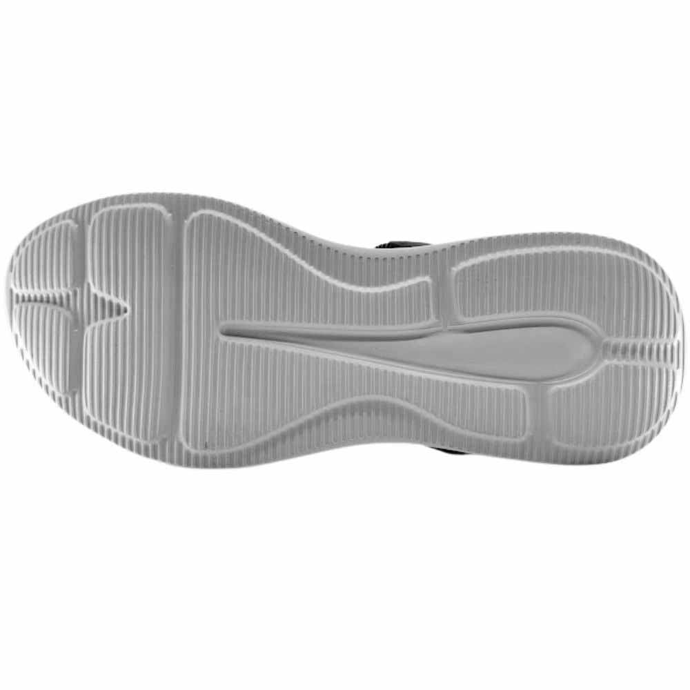 A top-down view of a white sandal sole, showing its textured tread pattern against a plain white background.
