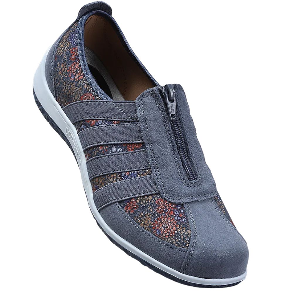 Blue slip-on shoe with floral pattern on a white background