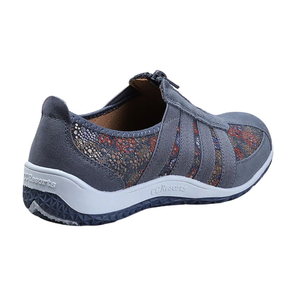 Blue casual shoe with patterned design on a white background
