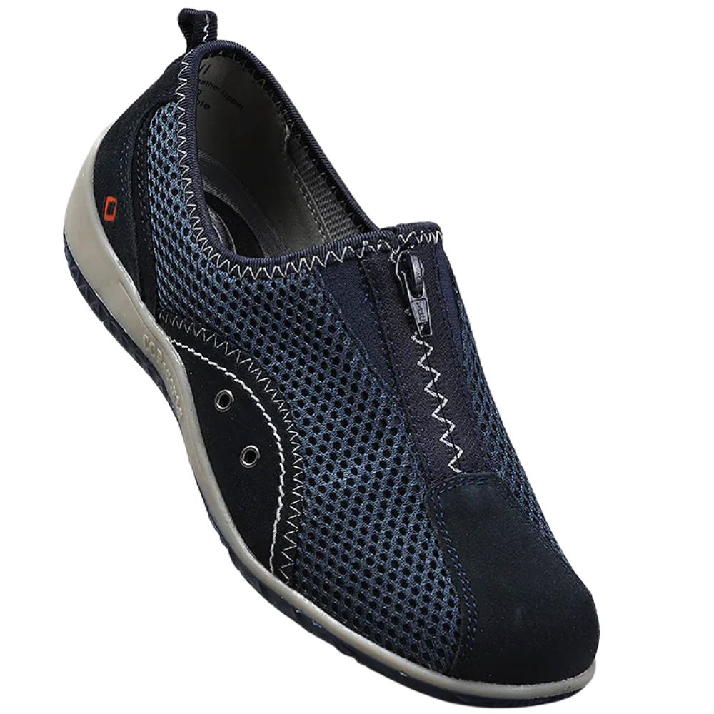 Navy blue slip-on shoe with white stitching on a white background
