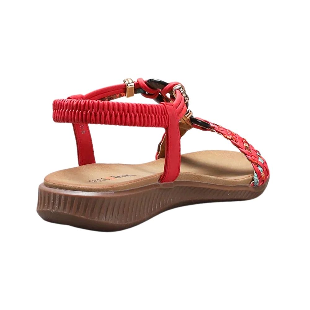 A red woven T-strap wedge sandal with a brown platform sole, shown from a side profile view on a white background.