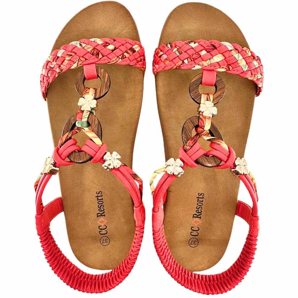 A pair of women's flat sandals with woven red straps, wooden circular accents, and elasticated back straps, shown on a white background. The insole is tan and features the brand name 'CC Resorts'.