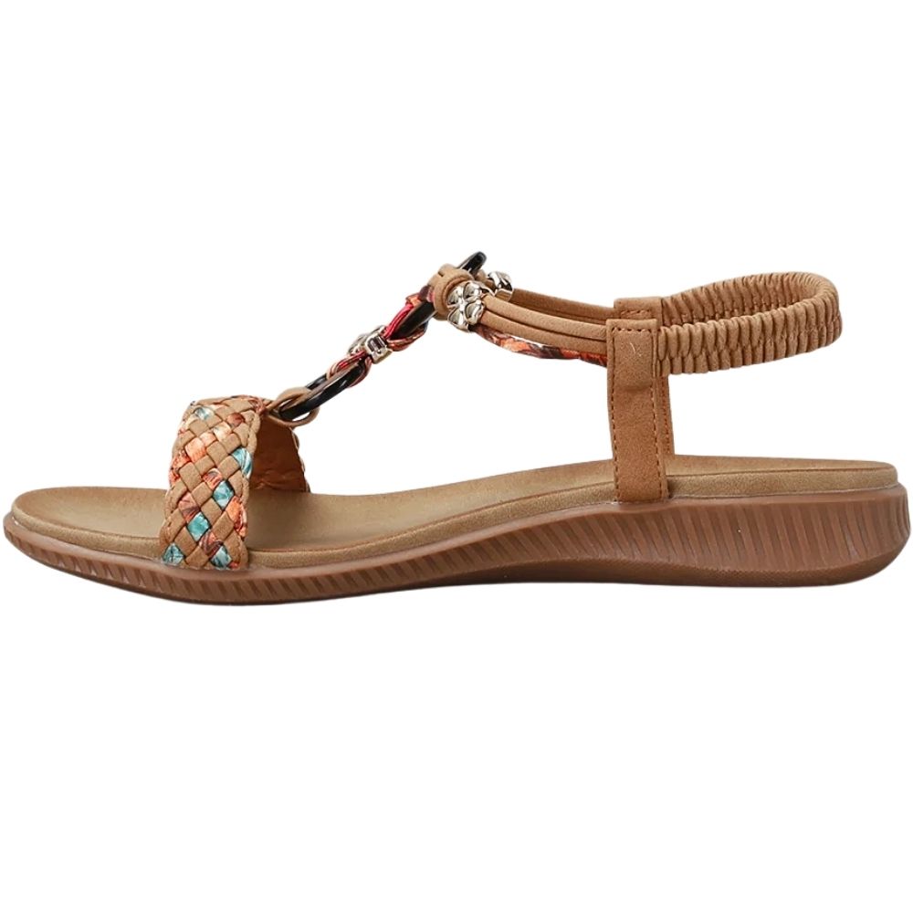 A women's brown wedge sandal with a braided T-strap featuring turquoise and red accents, and a braided ankle strap, shown from a side profile on a white background.